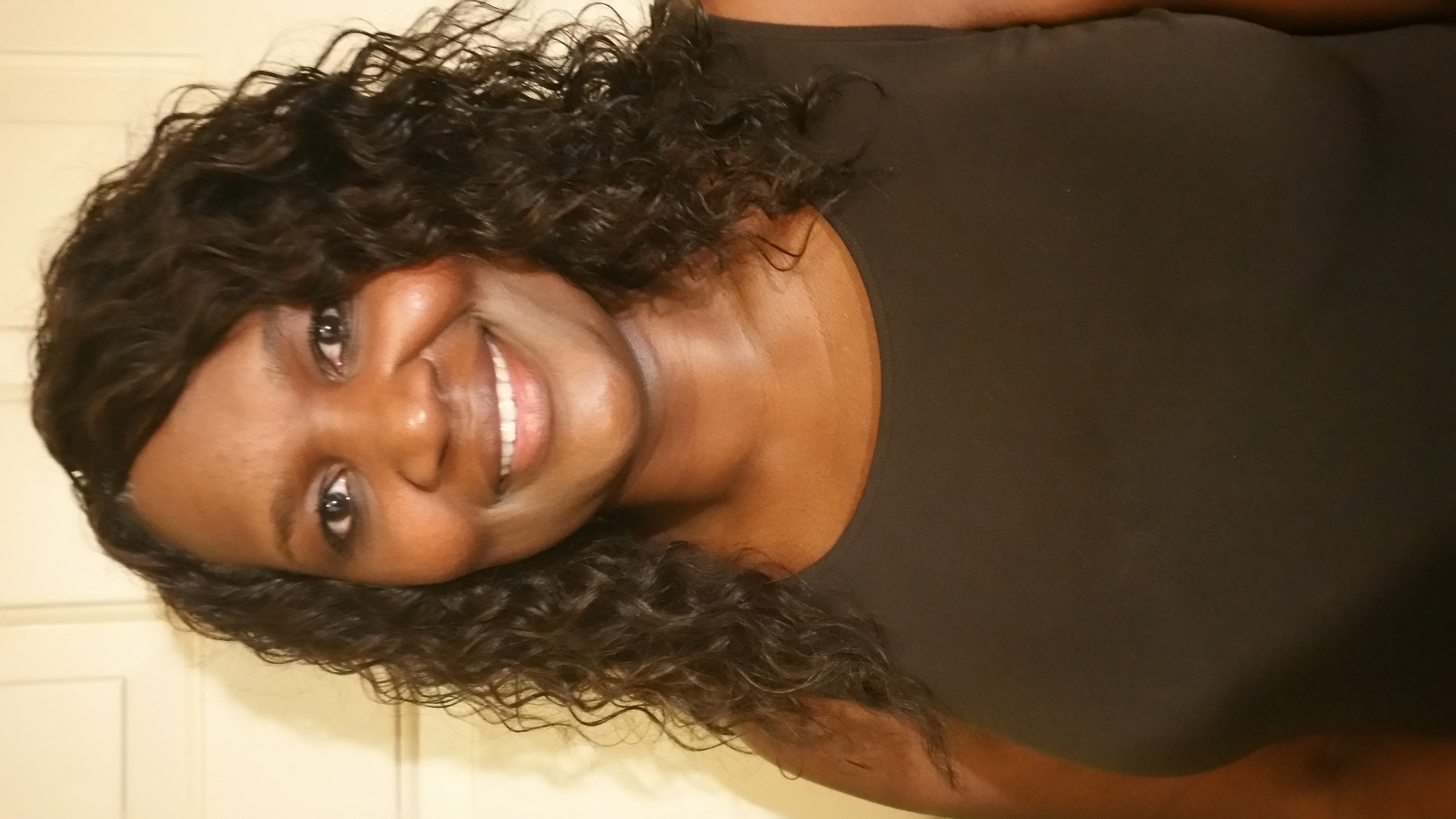 Beautiful curly weave style by Angel Hair Braids